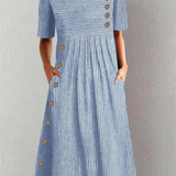"Marina - Elegante Vestido Midi a Rayas" could be rewritten as "Marina - Chic Vestido Midi a Rayas".