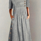 "Marina - Elegante Vestido Midi a Rayas" could be rewritten as "Marina - Chic Vestido Midi a Rayas".