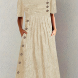 "Marina - Elegante Vestido Midi a Rayas" could be rewritten as "Marina - Chic Vestido Midi a Rayas".