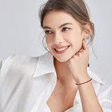 Elegancka srebrna bransoletka tenisowa z rubinem